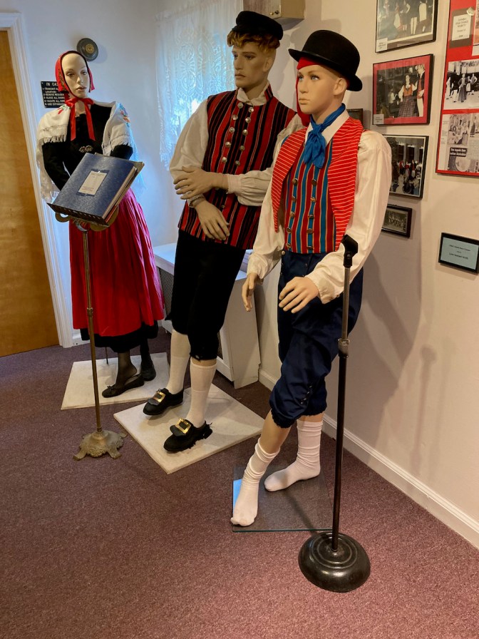 Three mannequins with Danish dancing attire.