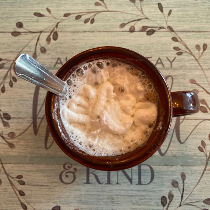 Cappuccino with cream on top.