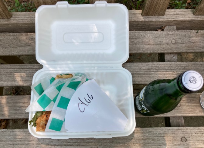 Paper box with crepe, and a ginger ale.