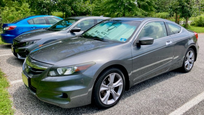 2012 Honda Accord, parked in parking lot, with sunshade that says Honda.