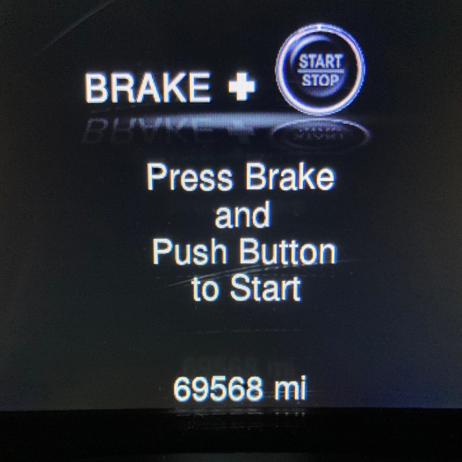 Car odometer reading 69568 miles.