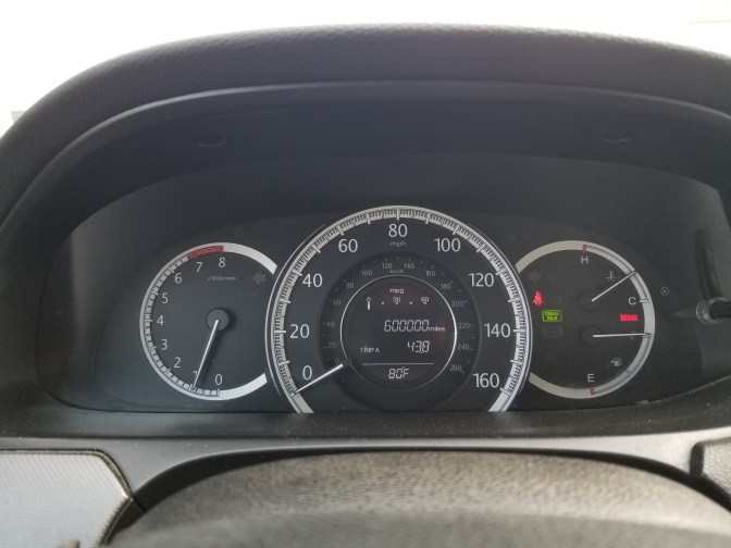 Car odometer reading 600000 miles.