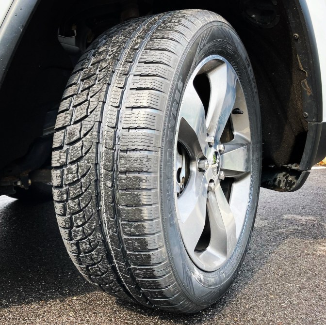 Nokian WR G4 SUV tire on Jeep Grand Cherokee. Closeup of wheel and wheel well.