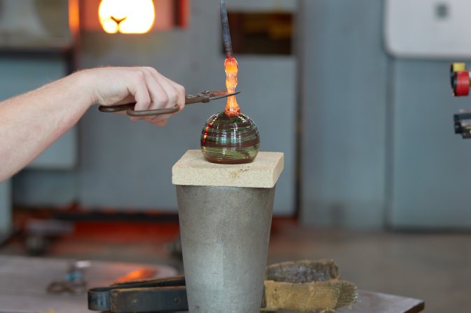 Ornament on block, with hook being added.