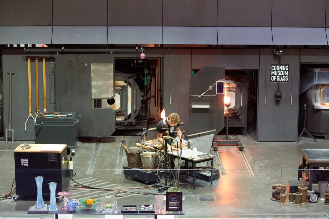Glass worker in glass studio.