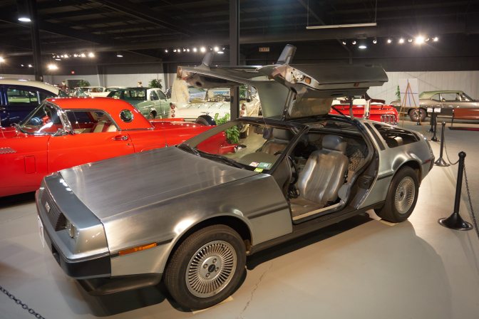 DeLorean DMC-12 with gull wing doors open.