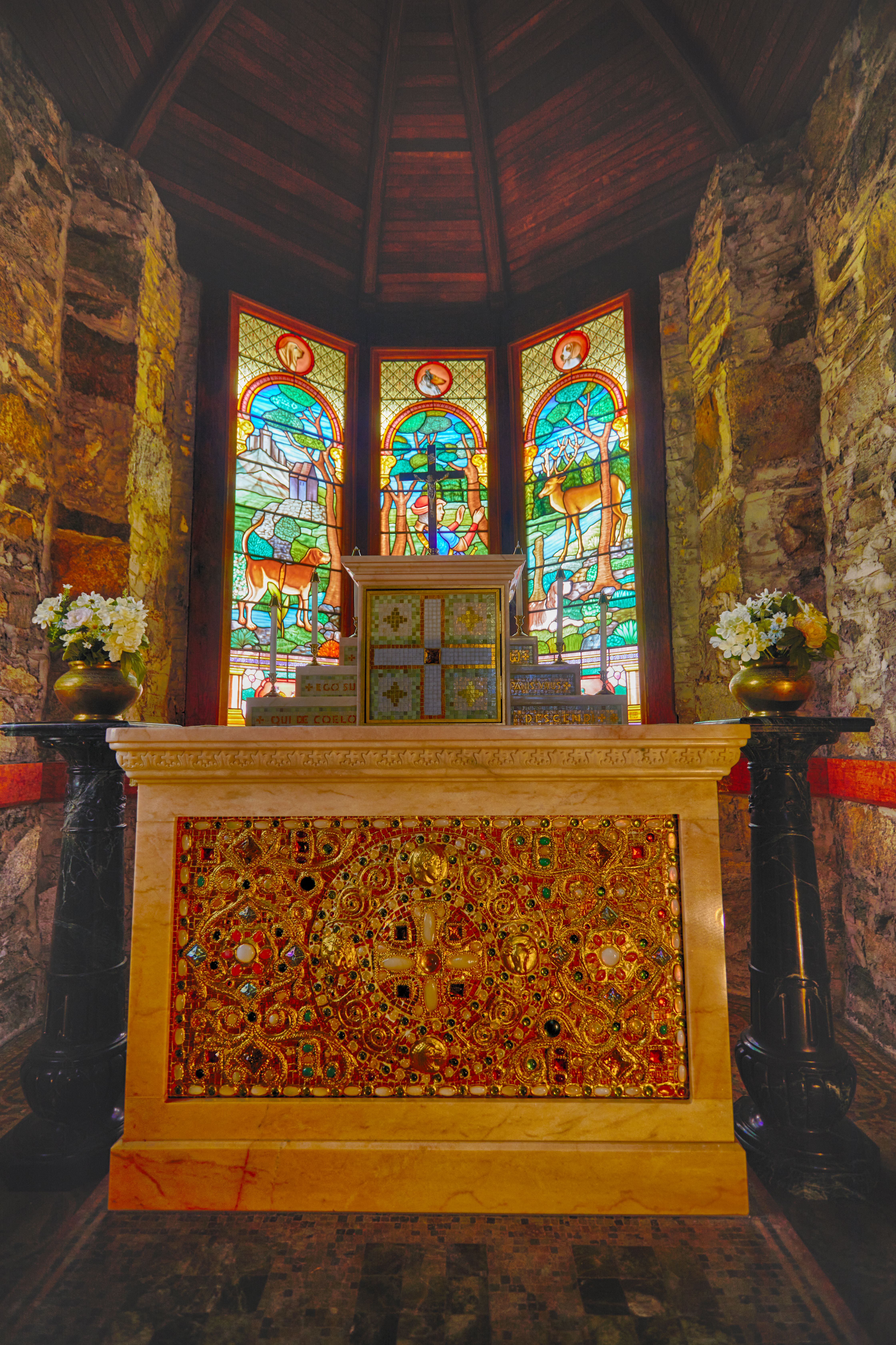 Altar and stained glass windows.