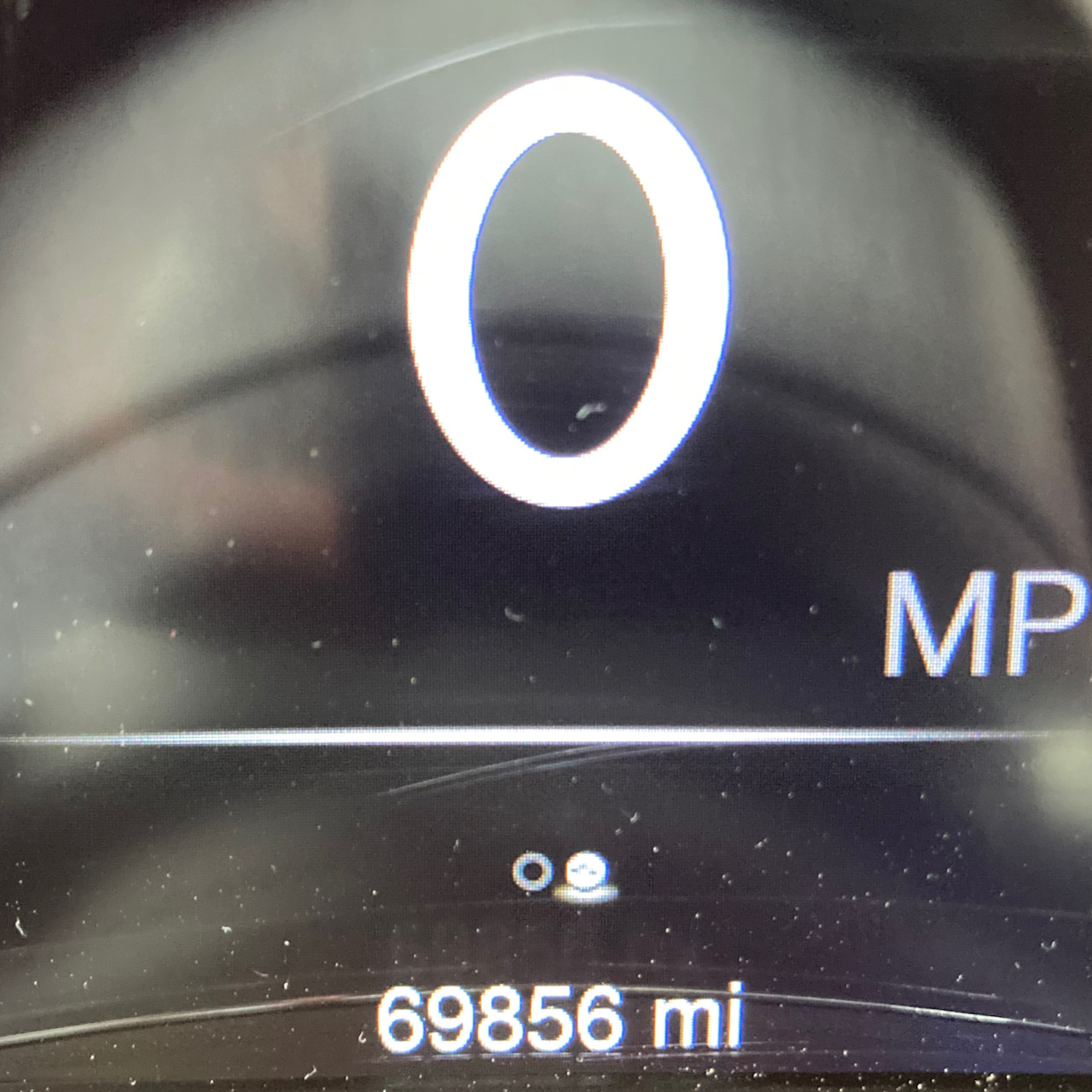 Car odometer reading 69856 miles.