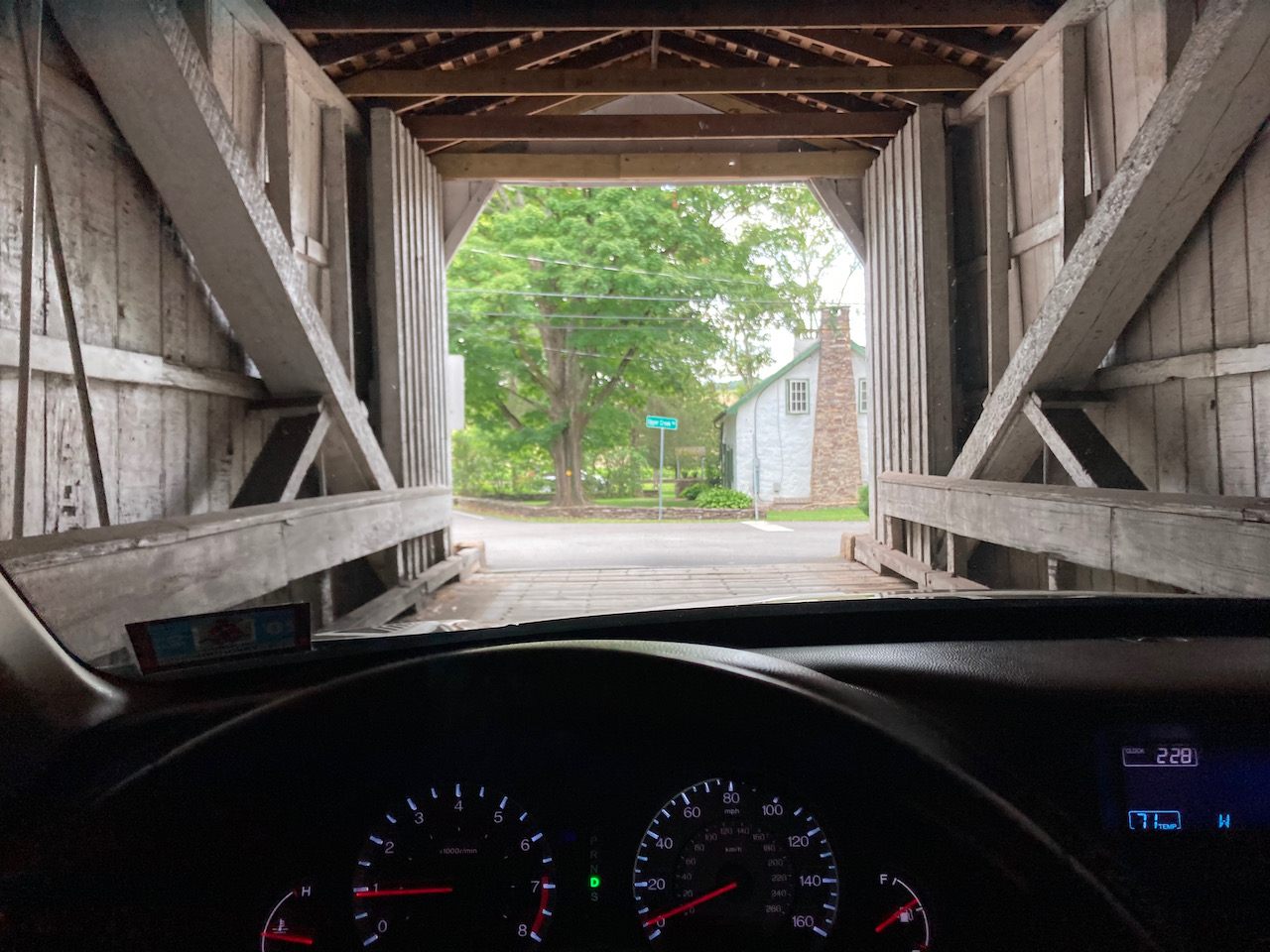 View from inside covered bridge, with dashboard of 2012 Honda Accord in foreground.