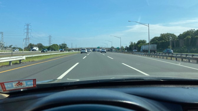 View of NJ Turnpike from behind dashboard of Honda Accord.