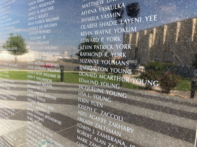 Inscriptions of names of 9/11 victims in granite.