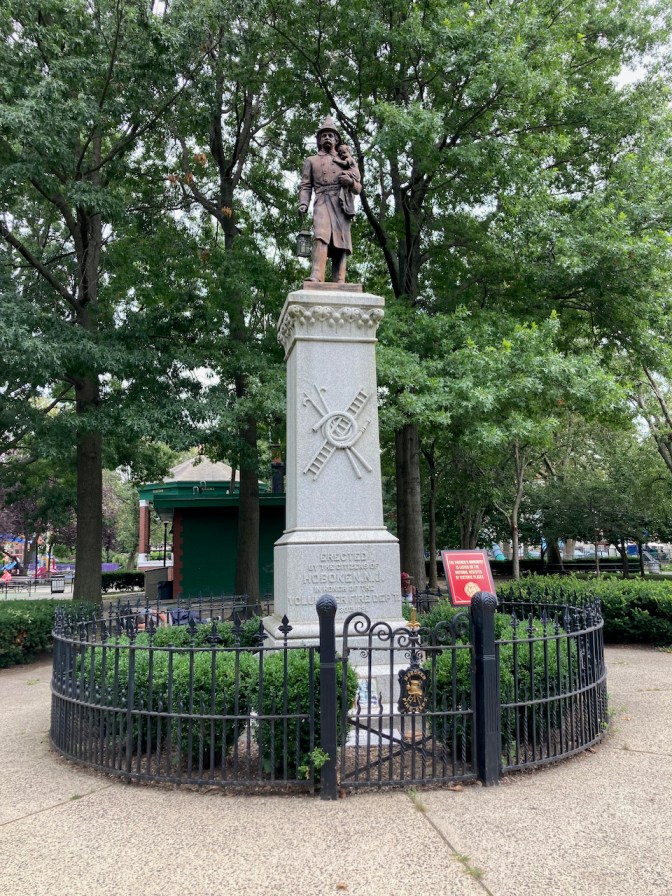 Firemen's Monument statue of fireman holding small child.