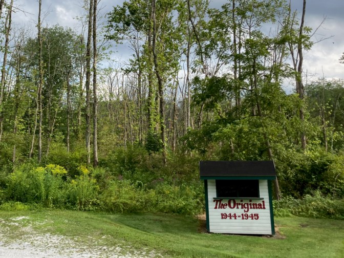 Small shack, made of white wood with black trim, that says THE ORIGINAL 1944-1945.
