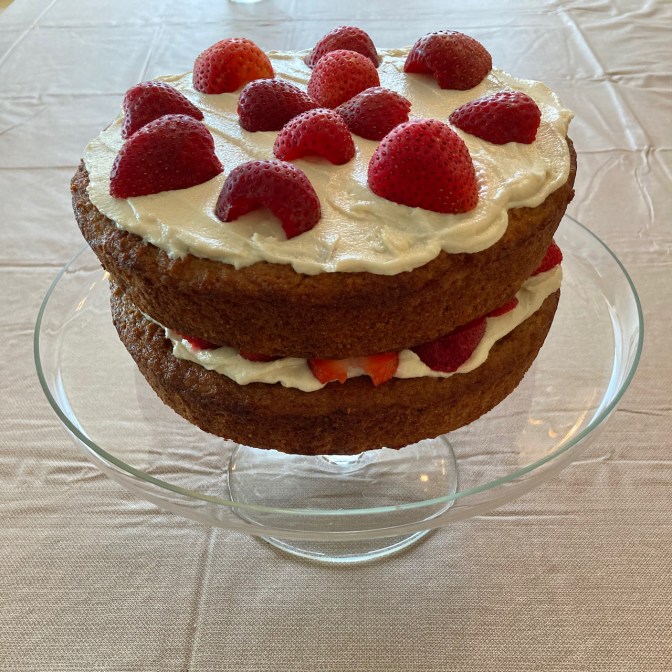 Strawberry shortcake on cake plate.