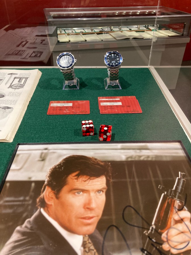 Display with Pierce Brosnan as James Bond, and two Omega watches.