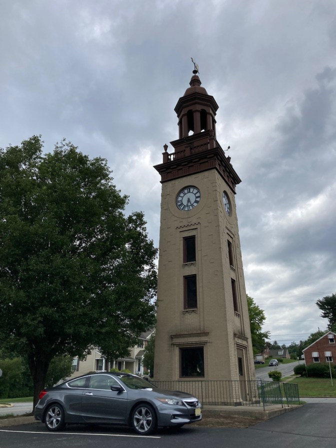 2012 Honda Accord parked in front of clock tower.