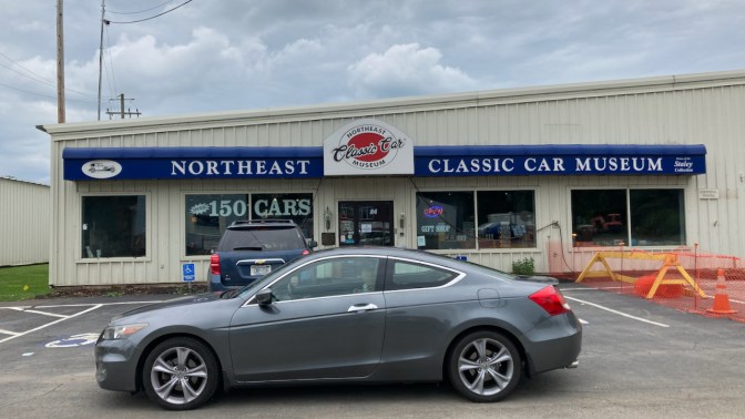 2012 Honda Accord parked in front of entrance to Northeast Classic Car Museum.