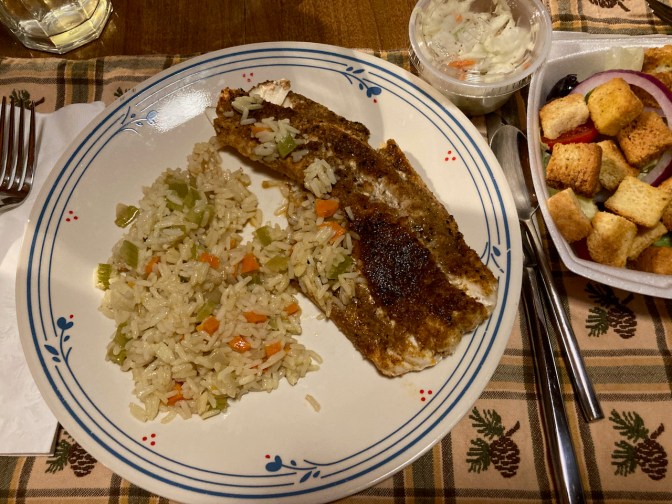 Blackened halibut, rice, and salad.