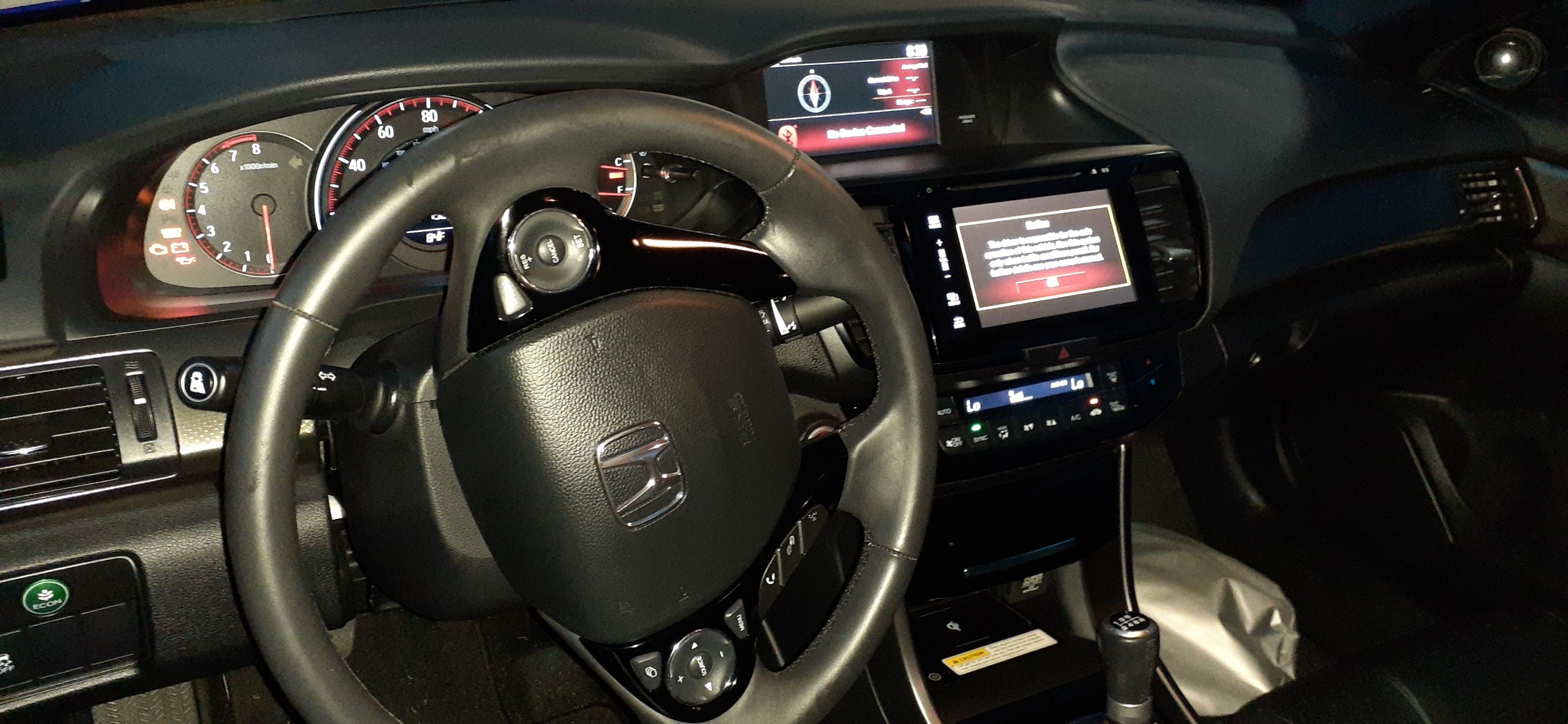 Interior of Honda Accord coupe. Interior trim is black.