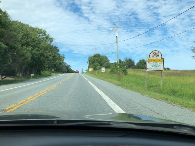 Maryland state welcome sign along side of road.