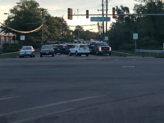 Abandoned cars in intersection.