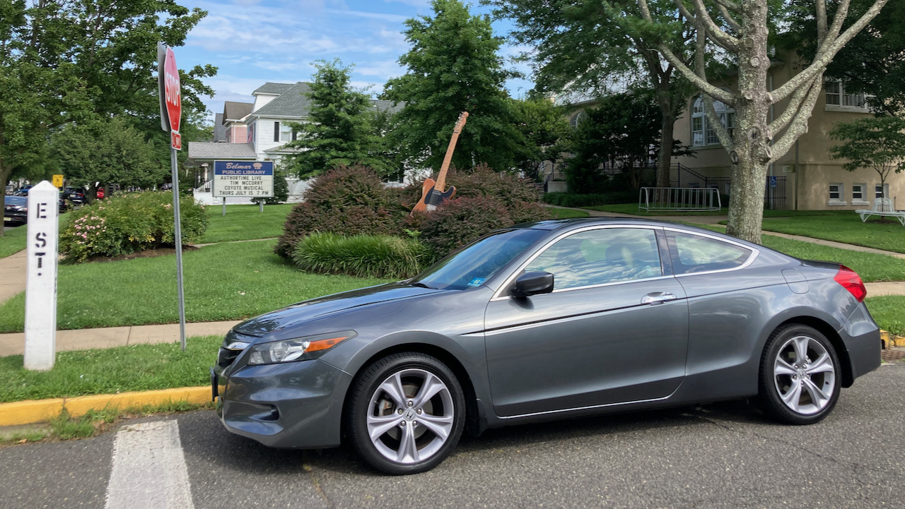 2012 Honda Accord in front of statute of Fender Esquire guitar.