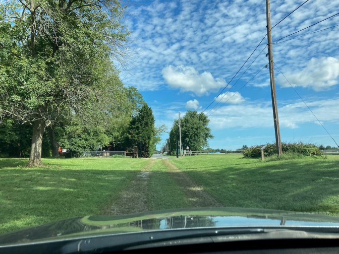 Honda Accord, driving through grassy driveway.