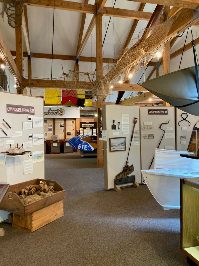 Exhibits on fishing and sailing in museum.