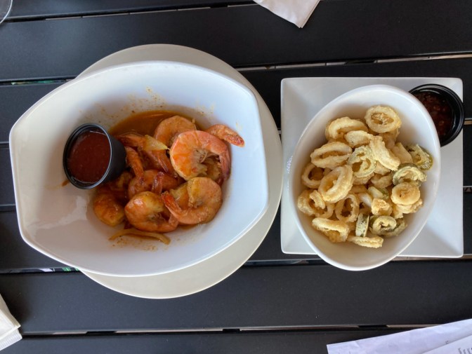 Plate with calamari, and bowl with steamed shrimp.