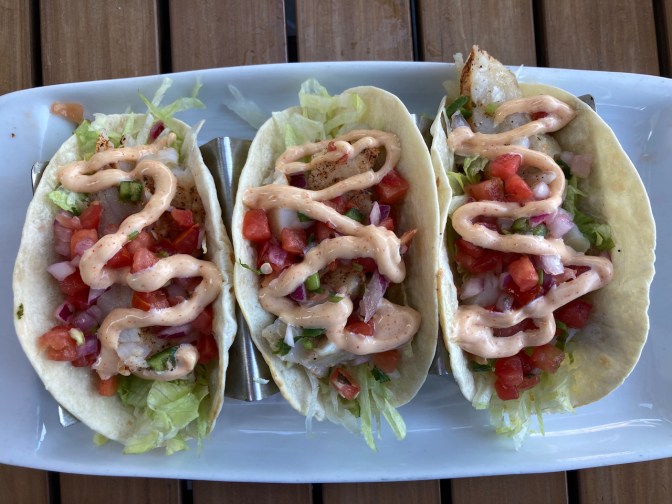 Platter of three fish tacos.