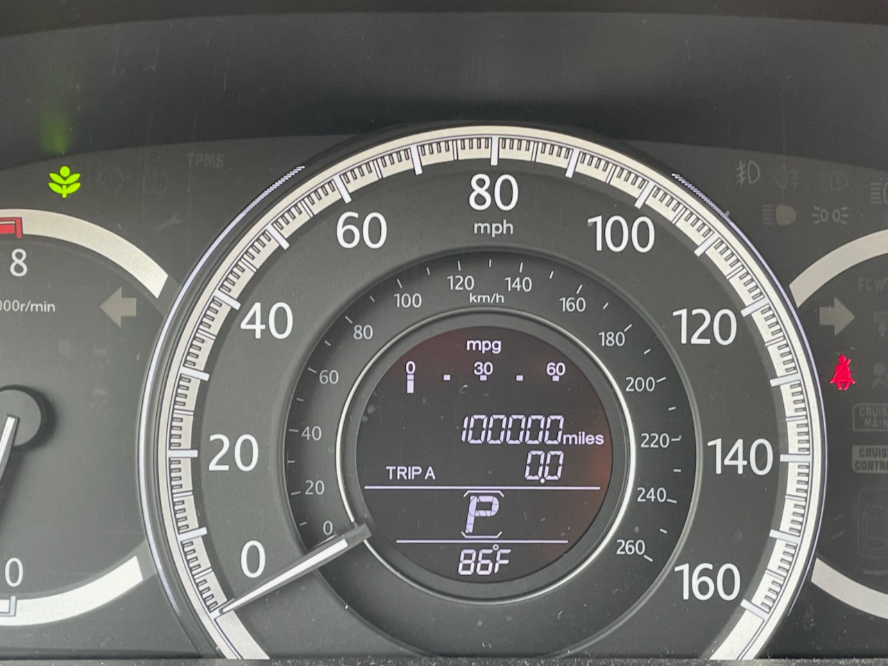 Odometer reading 100,000 miles.