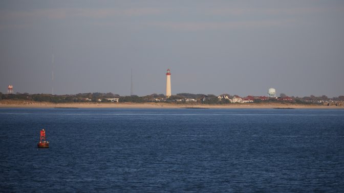 Cape may Lighthouse on beach in distance. 