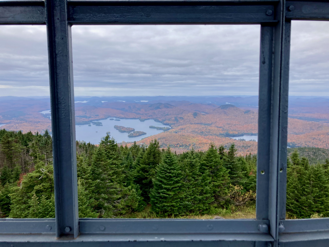 View of surrounding countryside through windows of Fire tower. 