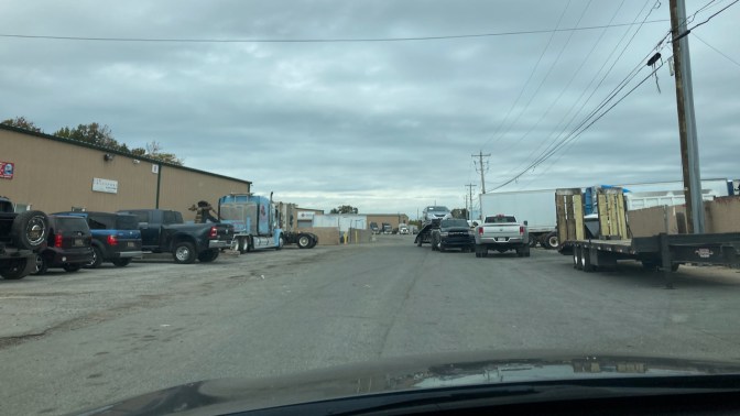 View of industrial complex parking lot. 