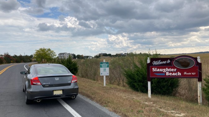 2012 Honda Accord parked beside "Welcome to Slaughter Beach."