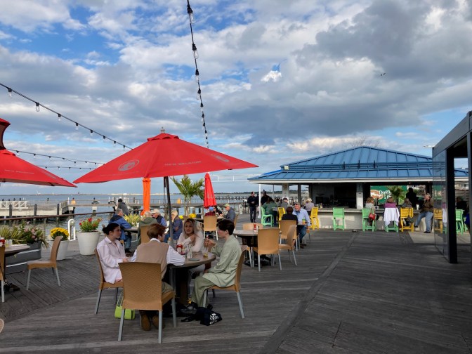 Outdoor patio bar and dining tables at ferry terminal. 
