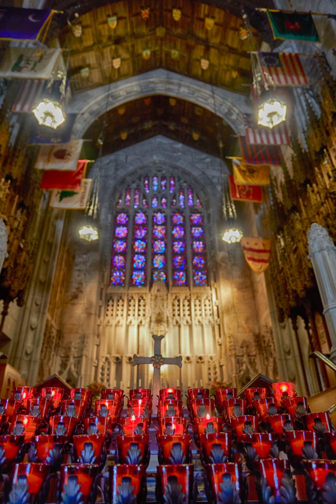 Altar and stained glass window inside of Washington Memorial Chapel. 