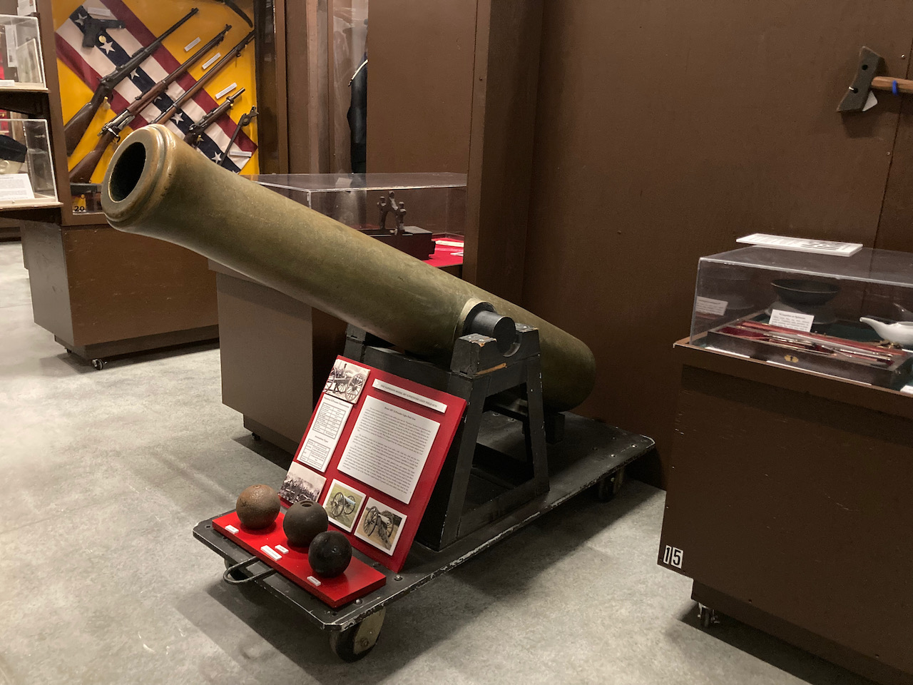 Napoleon artillery gun on rolling display cart.