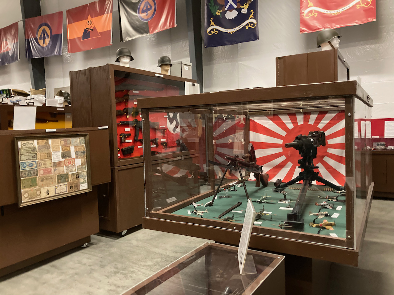Display cases of Japanese and Nazi German WWII weapons. 