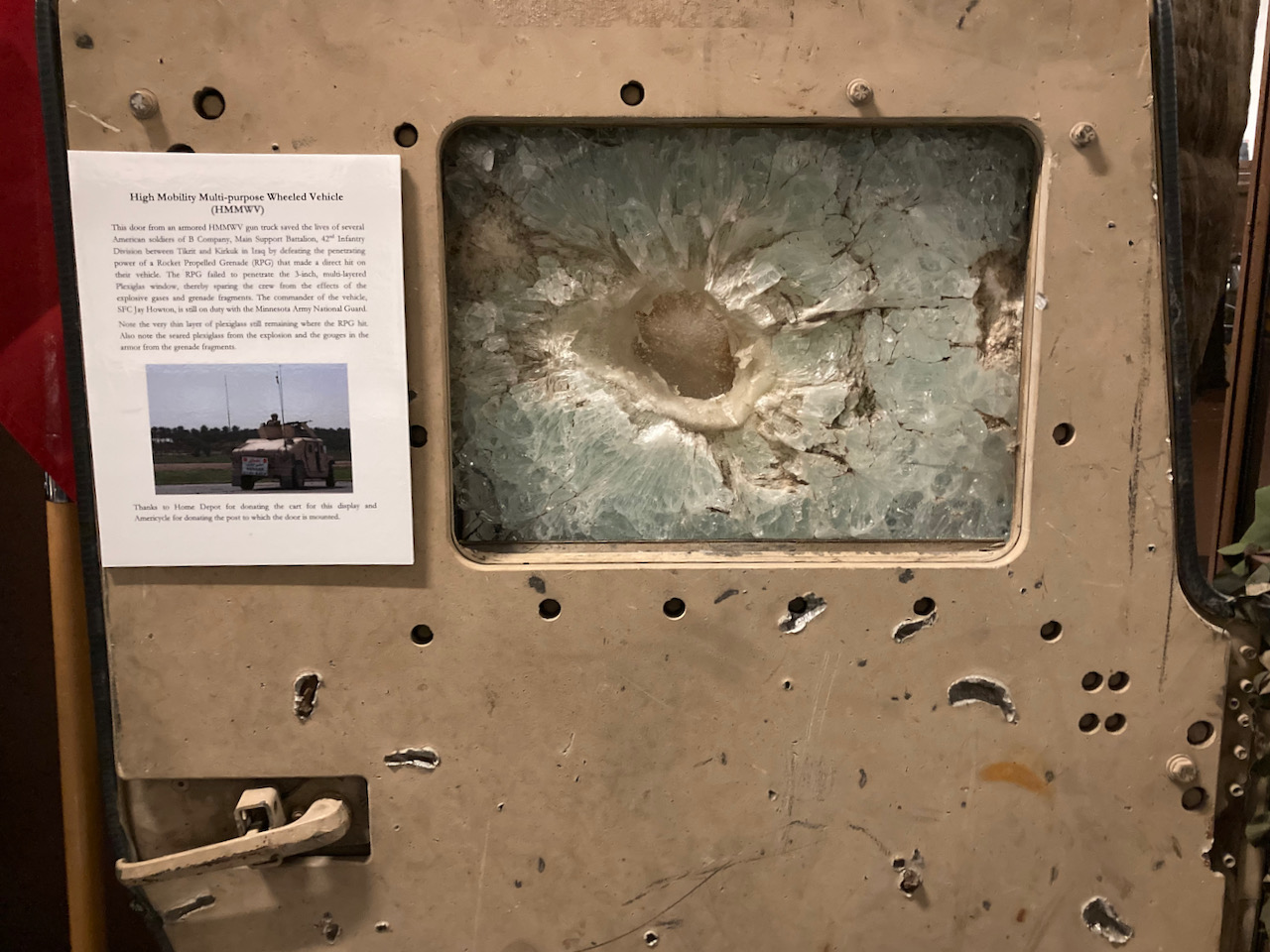 Door and window from HMMWV, damaged by rocket attack. 