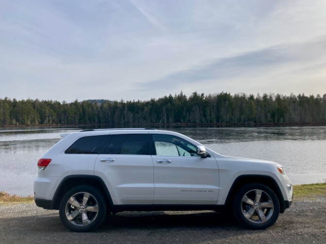 2014 Jeep Grand Cherokee parked in front of Quiver Pond. 