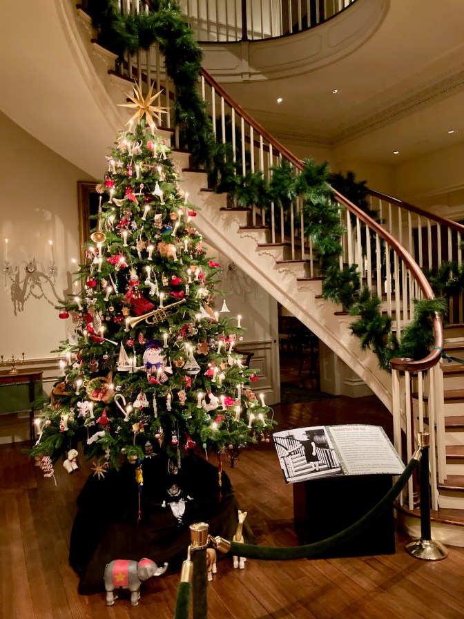 Christmas Tree in entrance hall, with spiral staircase in background. 