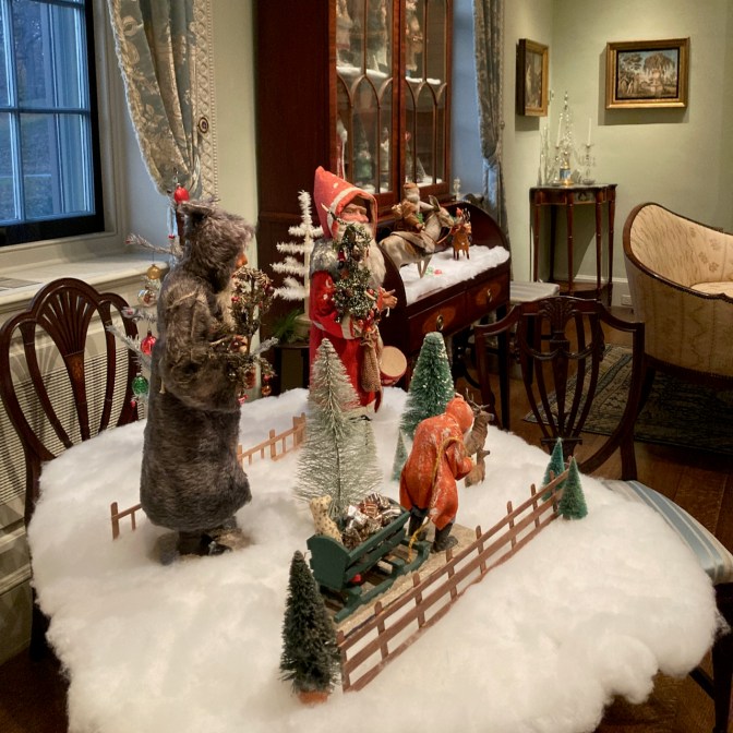 Paper mache figures of Santa Claus. 