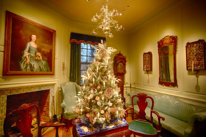 Readbourne Parlor, with tree on table in middle, large portrait over fireplace on the left, and sofa on right. 