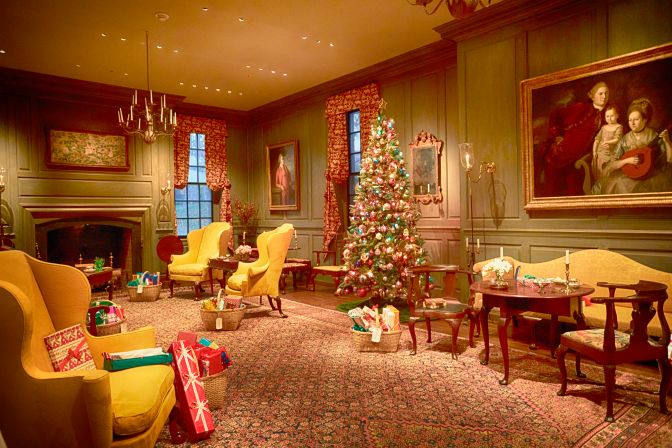 Marlboro Room, with tree in middle of room, and presents beside each chair and set in room. 
