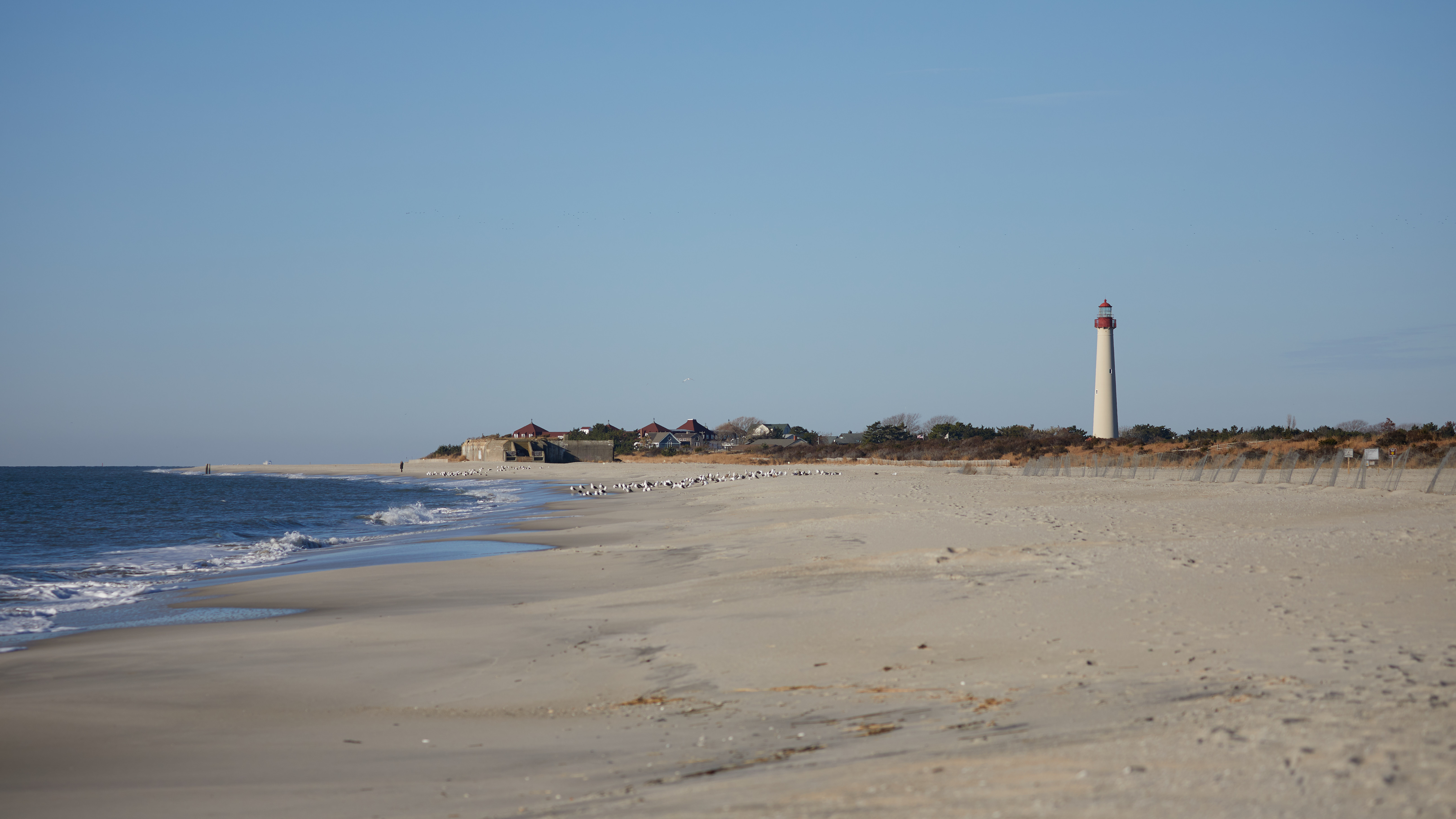 View of Cape May lighthouse from across beach.
