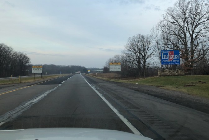 I-80 with Indiana welcome sign on right side of road.