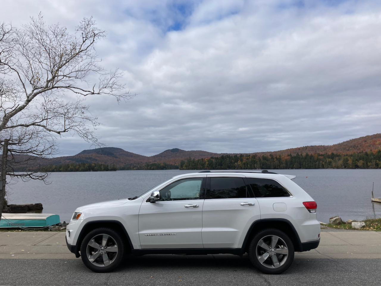 2014 Jeep Grand Cherokee, parked in front of Blue Mountain Lake.