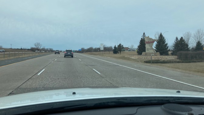 I-43 highway, with sign on right that says MINNESOTA WELCOMES YOU!