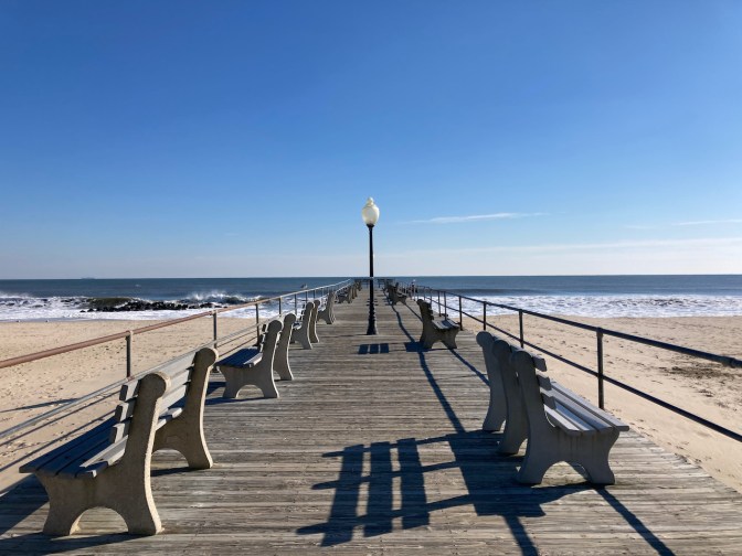 Pier extending out from Asbury Park boardwalk.